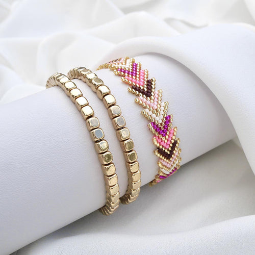 Pink Aura gold bracelet set with woven pink and fuchsia chevron