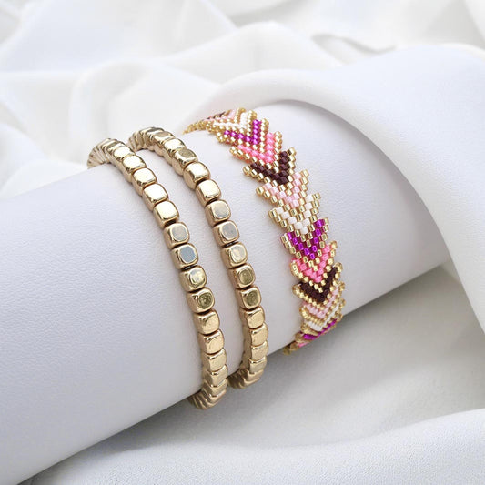 Pink Aura gold bracelet set with woven pink and fuchsia chevron